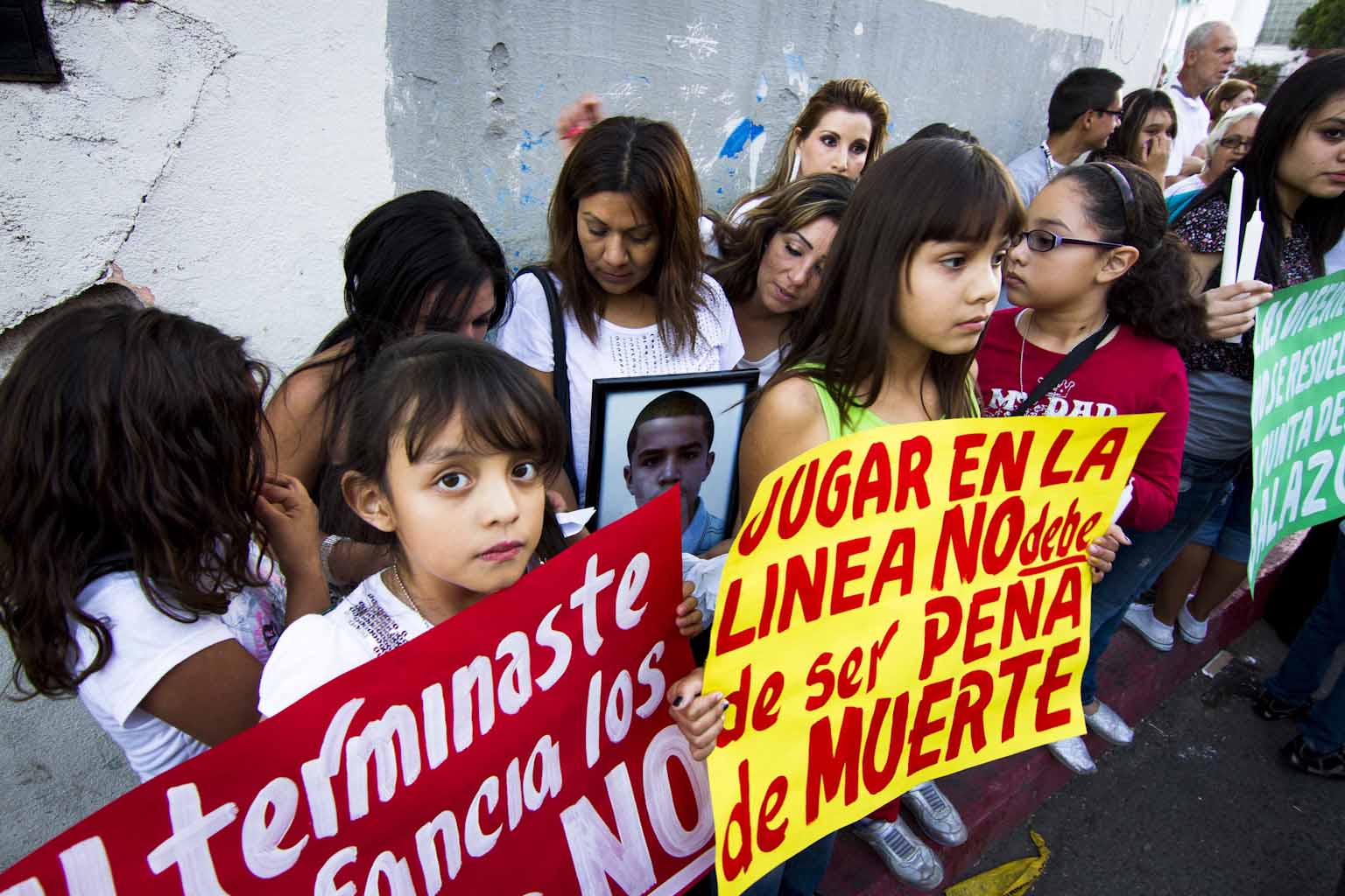Children gather at the site where José Antonio Elena Rodríguez was killed during a binational protest march, 2 November 2012.  Credit: Murphy Woodhouse.